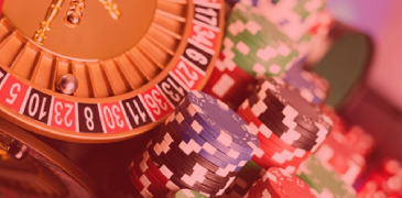 Close up of roulette and poker chips with overlay