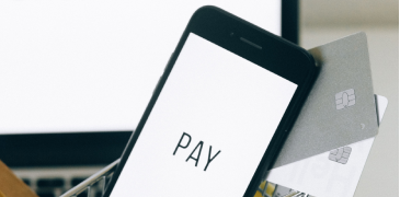 Mobile displaying the word pay