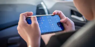 A person playing mobile games