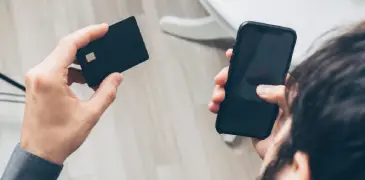 A man using his card to complete a payment