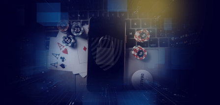 Overhead shot of a mobile on a keyboard surrounded by poker chips and playing cards