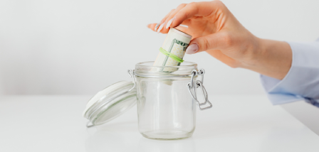 Putting money in a jar