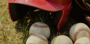 Closeup of baseball helmet and ball