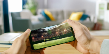 Point of view of a person streaming a live game on a mobile phone