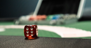 Closeup of a dice on a playing table